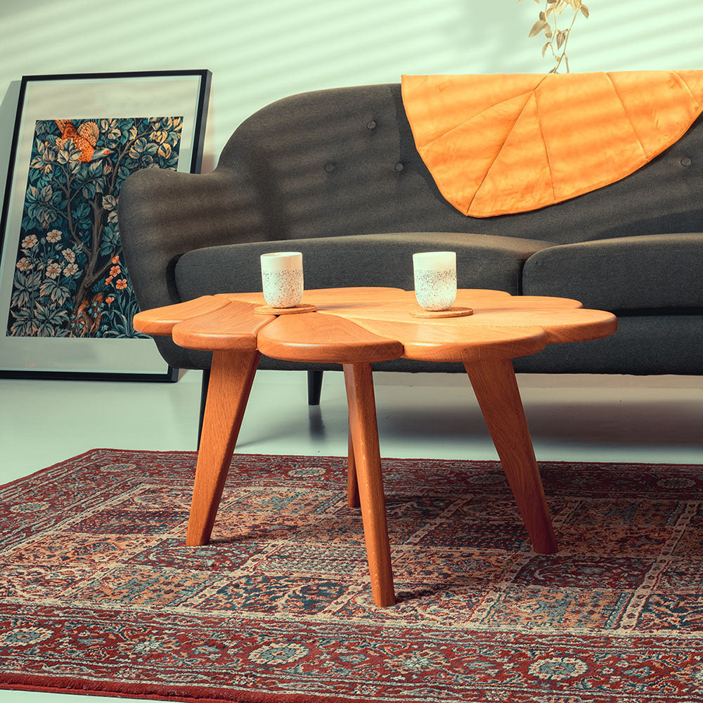 award winning 'Eikinot' coffee table in a living room setting with sofa and poster leaning against the wall