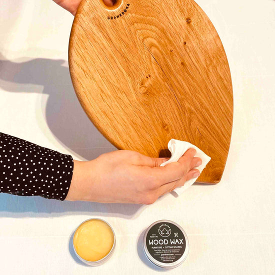 Hands applying wood wax by grankrona before buffing it
