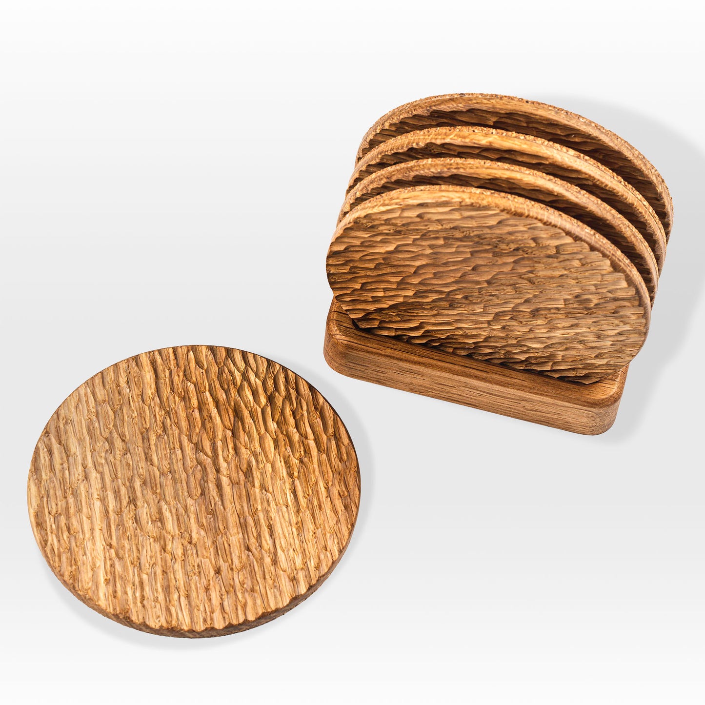 'Bark' wood coasters by Grankrona made from oak and shown from above at an angle