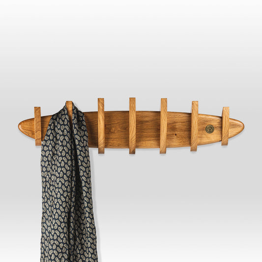 'Krona' coat hanger by grankrona in oak wood and with a scarf hanging on one of its hooks