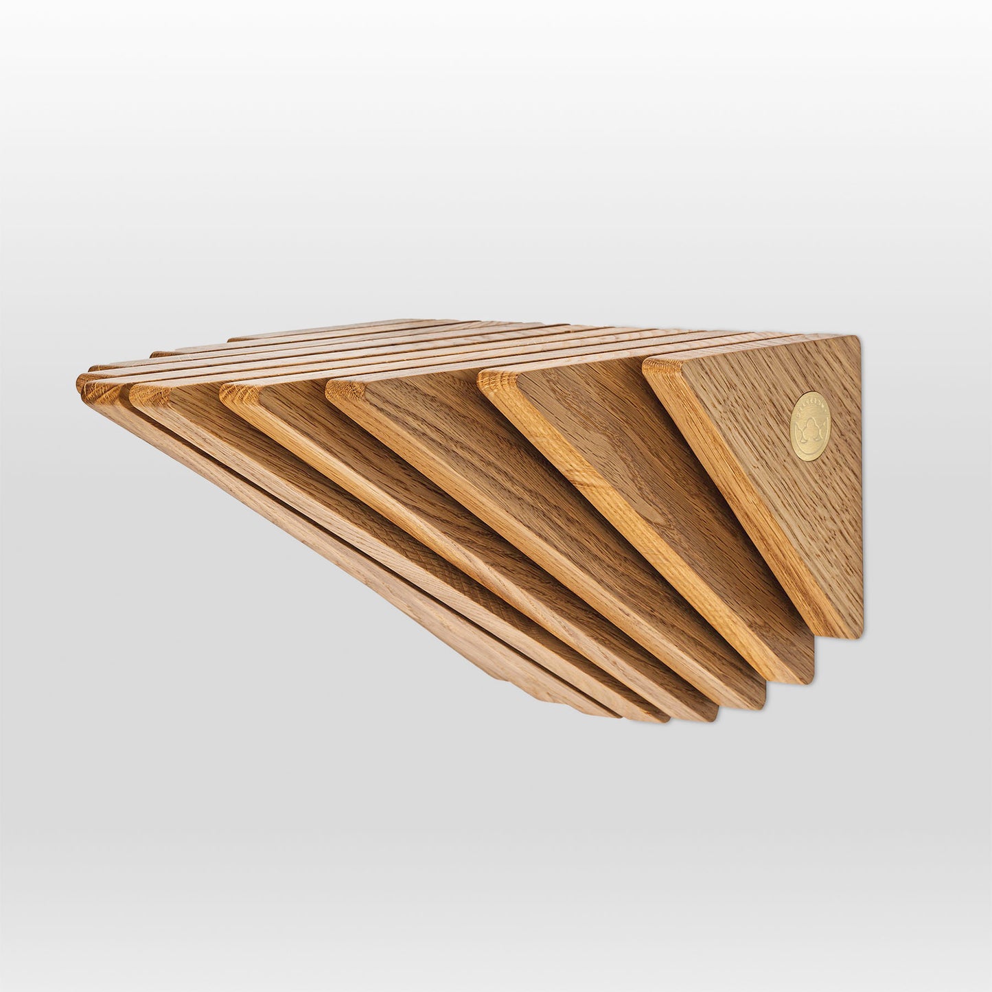 'Cliff' shelf by grankrona made from oak with brass logo