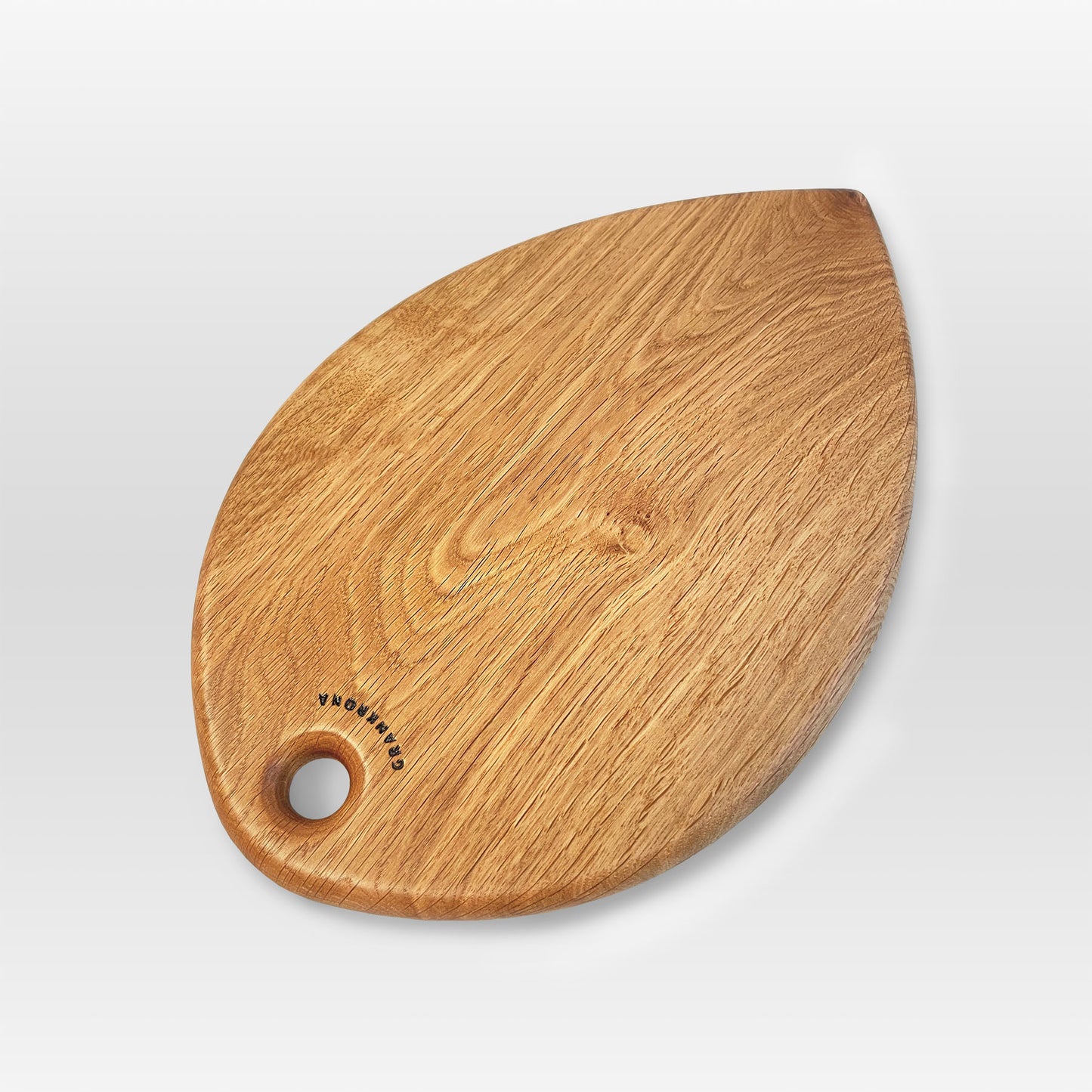 'Petal' serving board by grankrona with interesting oak grain pattern